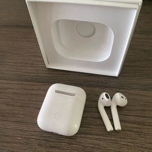Apple AirPods 2nd generation with charging case and box.